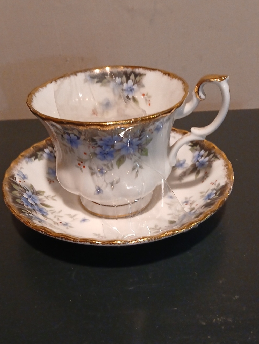 Royal Albert White and Blue Floral Teacup and Saucer with Gold Trim